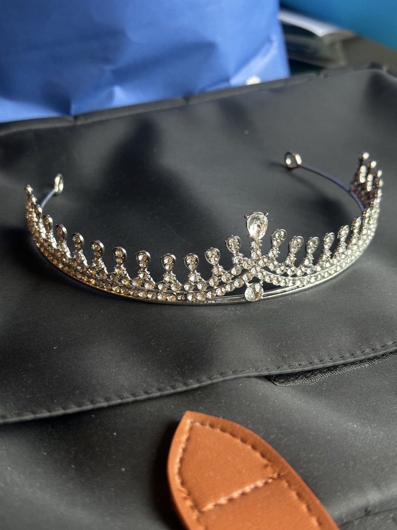 Silver Rhinestone Tiara Crown Hair Accessory (Category: Hair Accessories) located in Taguig. Submitted by ellajanee (Listing ID 1467233710, Image 1). Description: - Stunning silver rhinestone tiara with elegant teardrop crystal accents - Sturdy metal headband construction with sparkling stones embedded along the entire arch - Designed with convenient loop ends for secure pinning into hair - Ideal for weddings, proms, pageants, photo shoots, and c