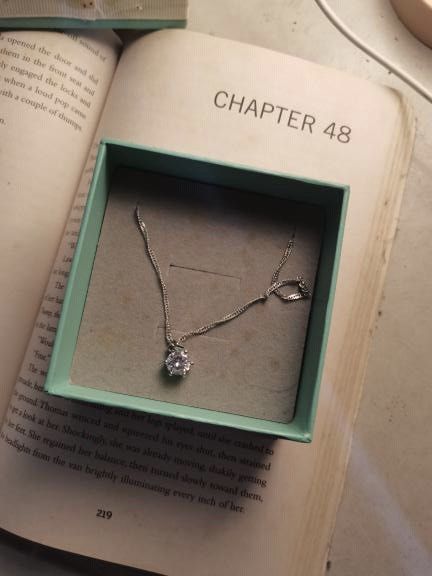 Silver Solitaire Pendant Necklace in Gift Box (Category: Necklaces) located in Manila. Submitted by geminibibo (Listing ID 1467335226, Image 1). Description: - Silver tone chain necklace with a sparkling round solitaire crystal pendant - Delicate design with a simple and secure closure near the back - Perfect for everyday wear or as a thoughtful gift - Comes safely stored inside a lovely light blue presentation box.