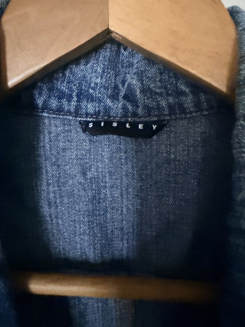 Sisley Denim Blazer Jacket (Category: Coats, Jackets and Outerwear) located in Manila. Submitted by amdra25 (Listing ID 1467190392, Image 3). Description: - Brand: Sisley - Style: Tailored denim blazer / jacket - Color/Wash: Medium blue - Details: Lapels, front button closure, two lower patch pockets with buttons, back panel stitching for a fitted look - Condition: Excellent / as good as new - Perfect casual wardrobe staple, easy to pair with tee