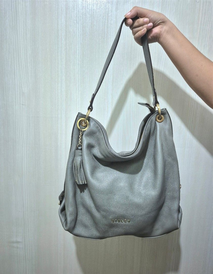 SISLEY Grey Leather Hobo Bag (Category: Shoulder Bags) located in San Mateo. Submitted by sellbypelle (Listing ID 1463823455, Image 2). Description: Brand: Sisley W: 15 inch H : 12 inch Issue: Surface scratch (see photo 5) 📍 Location: Rizal 📦 +shipping fee via J&T only ⏳ No rush shipping 💡 Actual color may vary slightly due to lighting and screen settings..