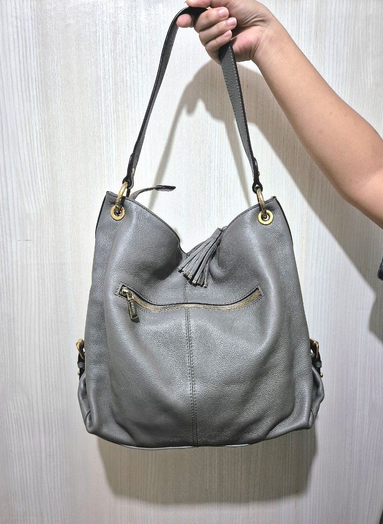 SISLEY Grey Leather Hobo Bag (Category: Shoulder Bags) located in San Mateo. Submitted by sellbypelle (Listing ID 1463823455, Image 3). Description: Brand: Sisley W: 15 inch H : 12 inch Issue: Surface scratch (see photo 5) 📍 Location: Rizal 📦 +shipping fee via J&T only ⏳ No rush shipping 💡 Actual color may vary slightly due to lighting and screen settings..