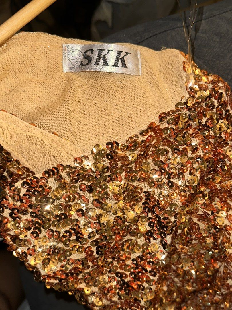 SKK Gold Sequinned One-Shoulder Dress (Category: Evening dresses & gowns) located in Manila. Submitted by tenshiii185 (Listing ID 1467257482, Image 2). Description: - Brand/Style: SKK gold and bronze sequinned one-shoulder dress - Fit & Length: Bodycon fit, knee-length style - Design: Fully covered in shiny sequins over a nude mesh lining with a side zipper - Occasion: Ideal for parties, clubs, and night outs - Condition: Worn once, still in grea