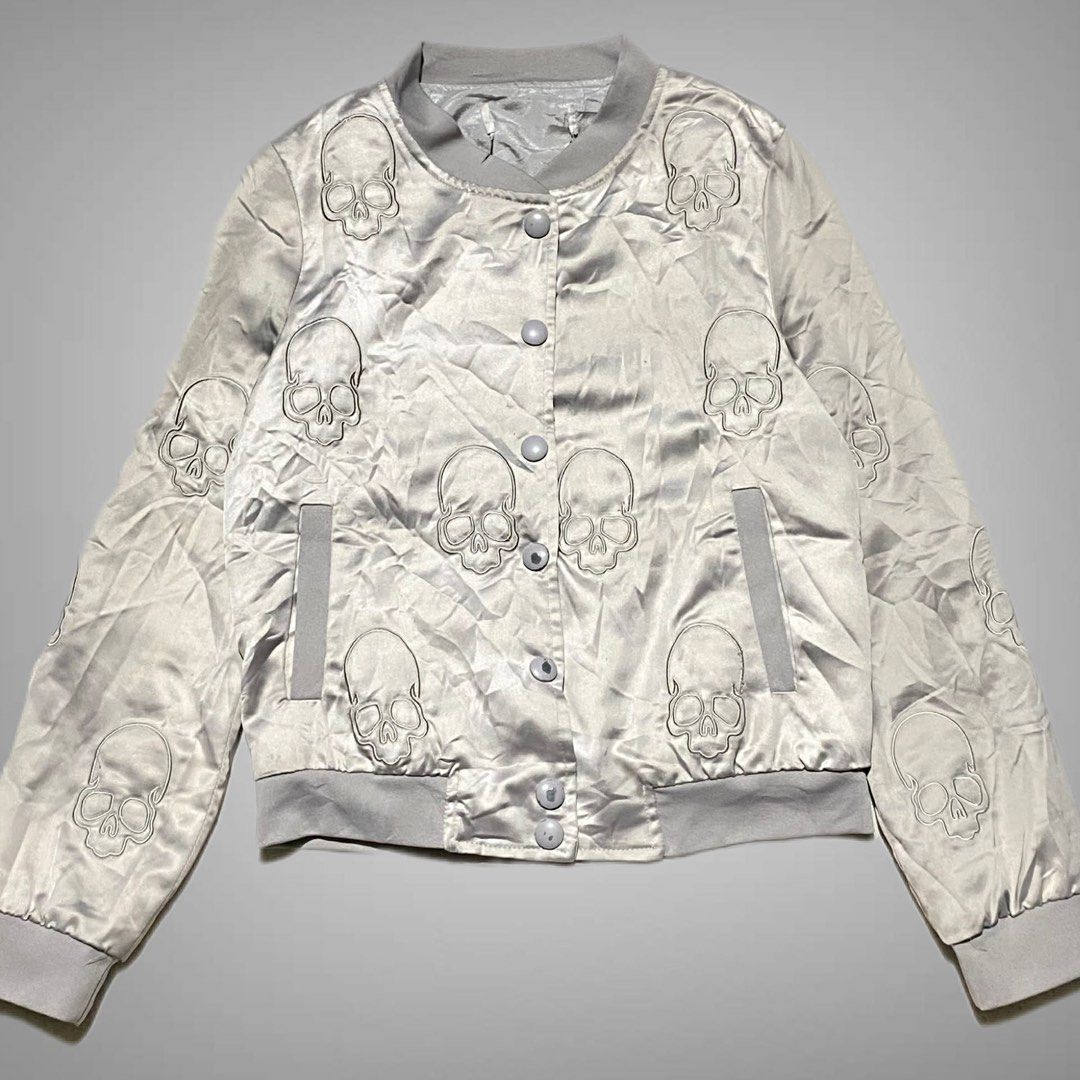 Skull Motor Jacket (Category: Coats, Jackets and Outerwear) located in Mabalacat. Submitted by stellargarments (Listing ID 1467309340, Image 1). Description: silver nag iiba color dahil sa lighting L: 19.5 W: 17 Condition : 9.8/10 super ganda ng details embroidered all logos masikip ribbings pantay po color sa lighting lang kaya nag iiba 🥰 with 2 pockets super nice & kinis! very comfy & smooth on skin need wash no major stain fresh from bale.