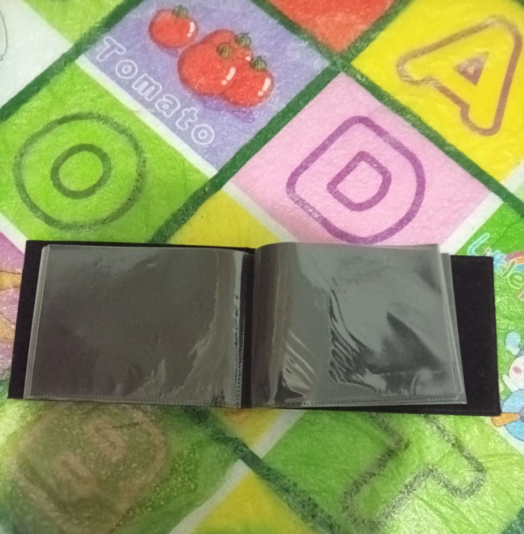 Small photo album with clear plastic pockets (Category: Stationery & School Supplies) located in Las Pinas. Submitted by mico090493 (Listing ID 1467361811, Image 3). Description: - lLike new and never been used - Bought in Norway - Compact mini photo album with clear plastic sleeves - Features a cute decorative frame insert on the front cover - Sleek black interior pages - Handy size, perfect for keeping small prints or photocards organized - Cle