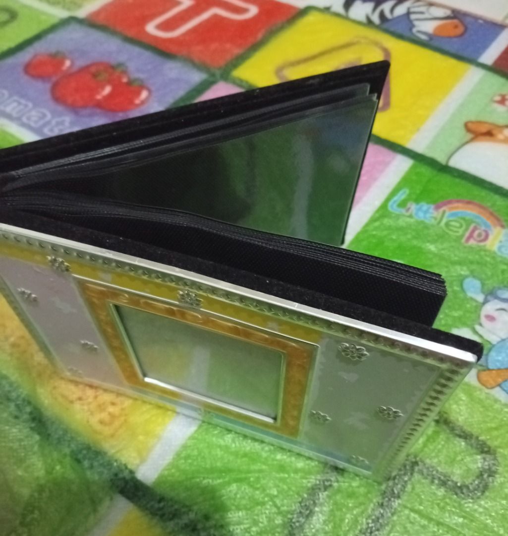 Small photo album with clear plastic pockets (Category: Stationery & School Supplies) located in Las Pinas. Submitted by mico090493 (Listing ID 1467361811, Image 2). Description: - lLike new and never been used - Bought in Norway - Compact mini photo album with clear plastic sleeves - Features a cute decorative frame insert on the front cover - Sleek black interior pages - Handy size, perfect for keeping small prints or photocards organized - Cle