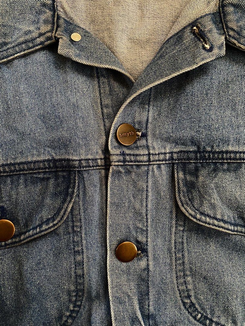 Smyth Blue Denim Jacket Size XL (Category: Coats, Jackets and Outerwear) located in Guagua. Submitted by zenn_vi (Listing ID 1467187551, Image 3). Description: - Brand: Smyth - Size: XL (Relaxed Fit) - Color: Classic Blue with contrast stitching - Material: Sturdy, durable denim - Details: Bronze-tone branded buttons, two front flap pockets, adjustable hem tabs - Condition: Great everyday layering piece for cooler weather.