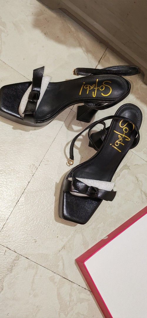 Sofab Black Platform Heels with Bow Detail (Category: Heels) located in Mandaluyong City. Submitted by trisha_001 (Listing ID 1467276201, Image 2). Description: - Brand: Sofab - Style: Black platform heels with thick flared heels, buckle ankle straps, and a cute front bow - Condition: Brand new, never worn, with protective packaging paper intact - Packaging: Comes in original pink box with SM Store tags.
