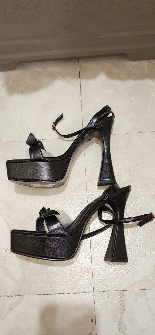 Sofab Black Platform Heels with Bow Detail (Category: Heels) located in Mandaluyong City. Submitted by trisha_001 (Listing ID 1467276201, Image 3). Description: - Brand: Sofab - Style: Black platform heels with thick flared heels, buckle ankle straps, and a cute front bow - Condition: Brand new, never worn, with protective packaging paper intact - Packaging: Comes in original pink box with SM Store tags.