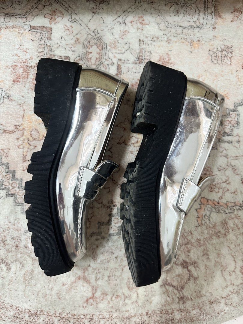 Sofab! Silver Metallic Chunky Platform Penny Loafers (Category: Loafers) located in Cebu City. Submitted by noemondragon (Listing ID 1467251661, Image 2). Description: - Brand: Sofab! - Style: Slip-on chunky heel penny loafers - Color/Finish: Silver metallic with reflective finish and chunky black lug soles - Details: Gold branding inside the insoles - Condition: Minor scuff marks near the collar (as pictured).