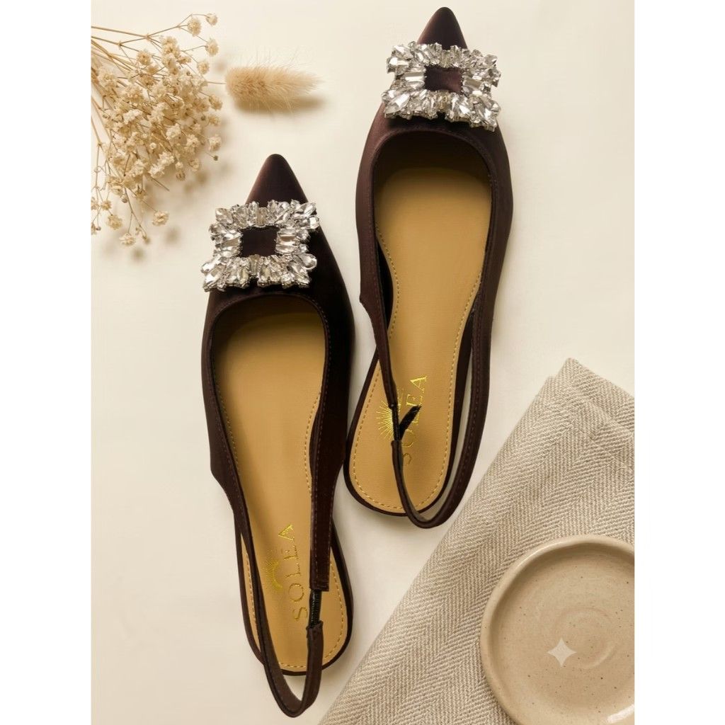 Solea Slingback Rhinestone Pointed Toe Flats (Category: Flats & Sandals) located in Paranaque City. Submitted by fourMs (Listing ID 1467225478, Image 2). Description: - Brand: Solea - Style: Pointed toe slingback flats - Color: Rich brown - Material: Satin with tan inner sole and branding - Feature: Large square crystal buckle on the front toe - Fit: Elastic heel strap for easy slip-on wear.
