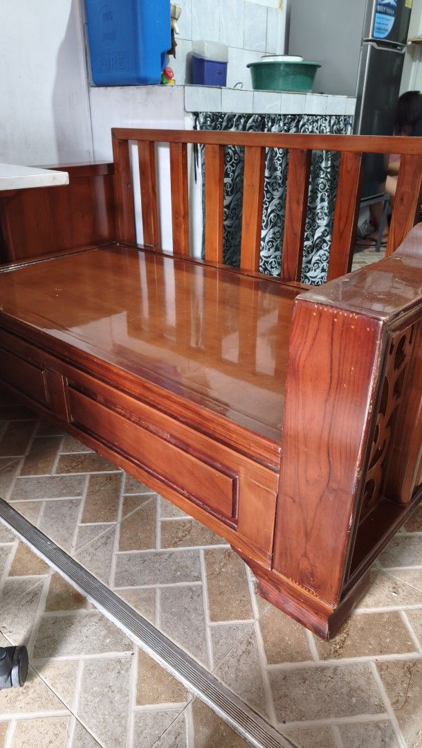 Solid Wooden Bench With Hidden Storage Compartment (Category: Chairs) located in Marikina City. Submitted by heylynzzyy008 (Listing ID 1467169476, Image 1). Description: For PICK-UP ONLY ‼️ Selling our large wooden storage bench with a beautiful reddish-brown finish and elegant decorative carved side panels. Price: 8,000 NEGOTIABLE RFS: Moving out ✅ Size 5-5.5 Feet long approx. ✅ Spacious built-in storage compartment ✅ Heavy and sturdy wooden con