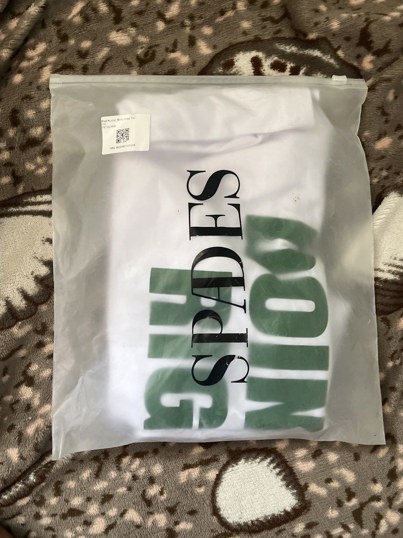 Spades Mad Hustler Boxy Crop Tee (Category: Tshirts & Polo Shirts ) located in Tarlac. Submitted by 444_conservative (Listing ID 1467181412, Image 1). Description: FS: SPADES ISSUE: nagbreak kami sayang pera - Brand: Spades - Style: White boxy crop tee - Size: XXL - Design: Green graphic face print on front, bold statement text on the back - Condition: Brand new in original ziplock packaging - Perfect for casual streetwear looks!.