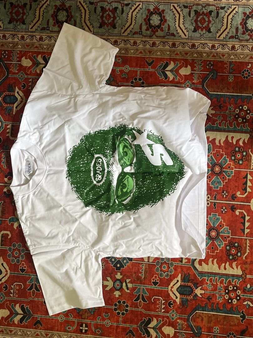 Spades Mad Hustler Boxy Crop Tee (Category: Tshirts & Polo Shirts ) located in Tarlac. Submitted by 444_conservative (Listing ID 1467181412, Image 2). Description: FS: SPADES ISSUE: nagbreak kami sayang pera - Brand: Spades - Style: White boxy crop tee - Size: XXL - Design: Green graphic face print on front, bold statement text on the back - Condition: Brand new in original ziplock packaging - Perfect for casual streetwear looks!.