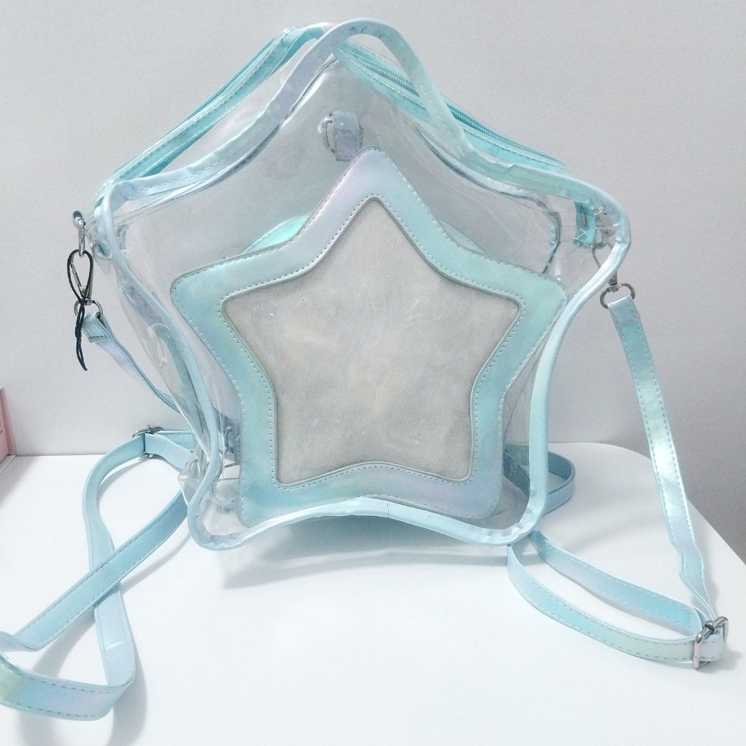 Star Backpack/Sling bag/Cross-body itabag (Category: Backpacks) located in Antipolo. Submitted by pandasal (Listing ID 1467191510, Image 1). Description: Decluttering so letting go of this star itabag Two bags in total = one big transparent + smaller star bag Can be used as a backpack or cross-body bag Used only once for an event The bag insert for the smaller star bag has obvious piercings from my can badges.