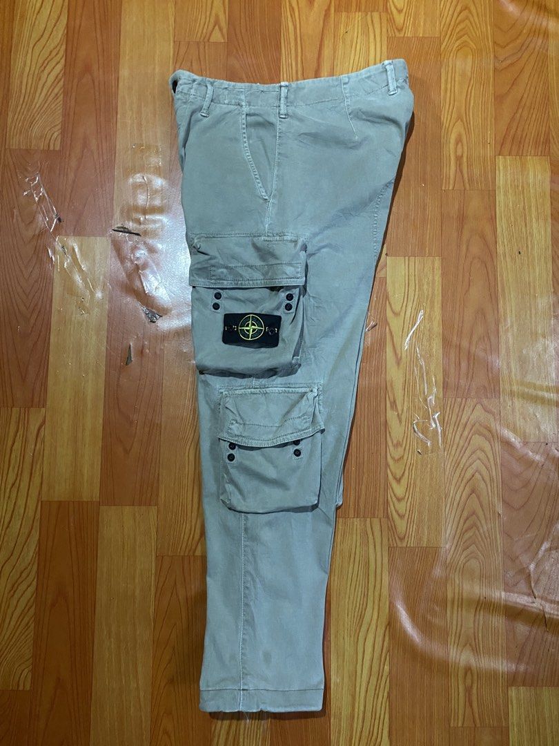 Stone island cargo pants (Category: Joggers) located in Cebu City. Submitted by jerianix (Listing ID 1467336852, Image 3). Description: Stone island cargo pants Size 30 Actual 32” base tapemeasure Length 37” Good condition Issue: pinhole & scratchs (see on last picture) .