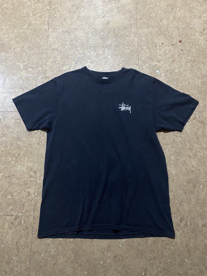 Stussy Black Tee with White Logo (Category: Tshirts & Polo Shirts ) located in Ozamiz City. Submitted by hakdmxma (Listing ID 1467267008, Image 1). Description: - Brand: Stüssy - Color: Black - Size: Medium (Standard fit) - Material: 100% Cotton (Made in Honduras) - Design: Small logo on chest, large graphic print on the back - Neckline: Crew neck - Condition: Pre-loved with light fabric fading and minor back print cracking from washing.