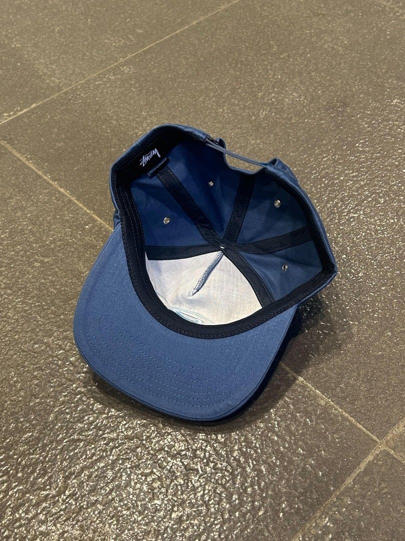 Stussy blue snapback cap with 8 ball logo (Category: Caps & Hats) located in Pasig City. Submitted by paulclzdo (Listing ID 1467208217, Image 3). Description: - Brand: Stussy - Design: Blue snapback cap with embroidered 8 ball logo on front - Brim: Classic flat brim - Closure: Adjustable snapback at the back - Details: Metal ventilation eyelets, interior taped seams, and branded woven tag - Condition: Clean structure with vibrant embroidery.