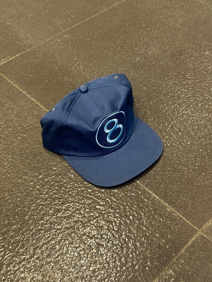 Stussy blue snapback cap with 8 ball logo (Category: Caps & Hats) located in Pasig City. Submitted by paulclzdo (Listing ID 1467208217, Image 1). Description: - Brand: Stussy - Design: Blue snapback cap with embroidered 8 ball logo on front - Brim: Classic flat brim - Closure: Adjustable snapback at the back - Details: Metal ventilation eyelets, interior taped seams, and branded woven tag - Condition: Clean structure with vibrant embroidery.