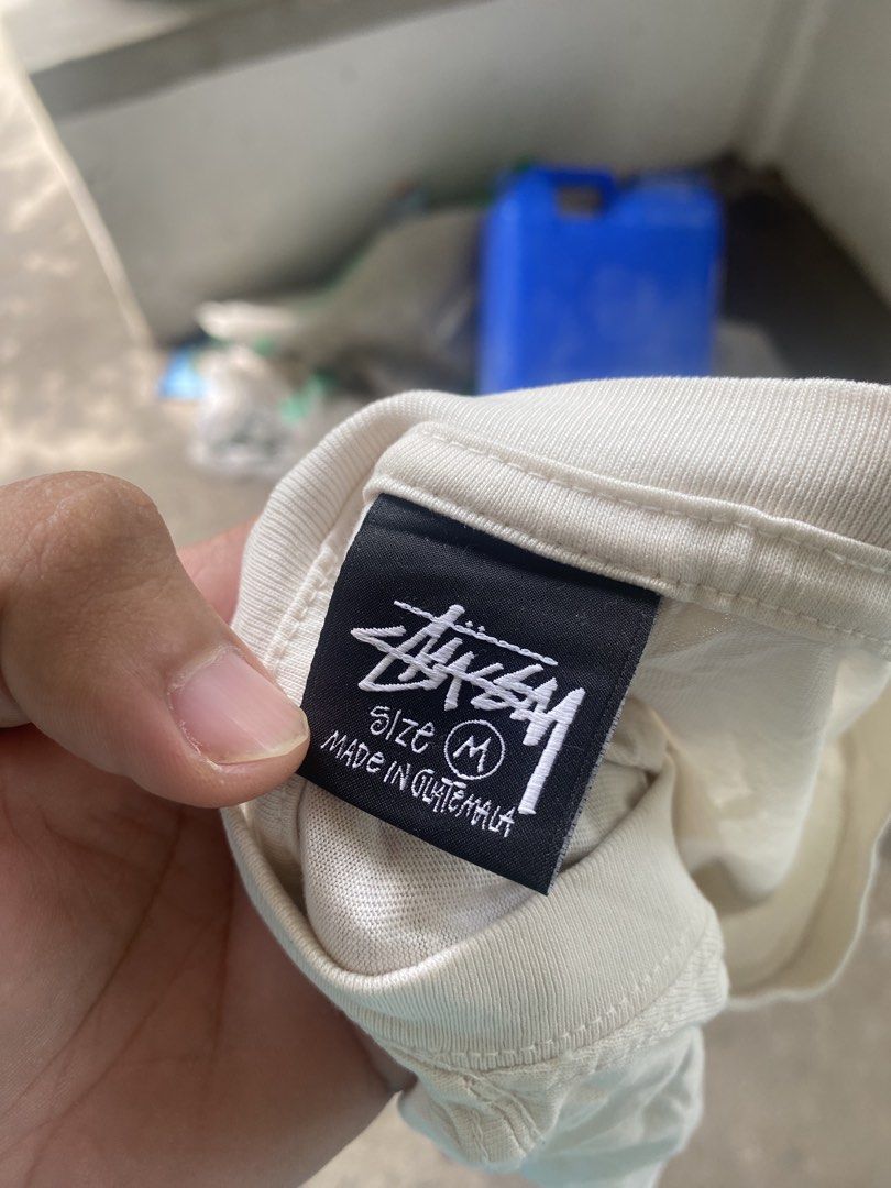 Stussy Graphic Tee White Size M (Category: Tshirts & Polo Shirts ) located in General Santos City (Dadiangas). Submitted by killcloa2368358 (Listing ID 1467340183, Image 3). Description: - Brand: Stussy - Color: White - Size: Medium - Material: 100% Cotton (Made in Guatemala) - Fit: Standard short sleeve crewneck - Design: Small left-chest logo and large alien doll back graphic with signature branding - Condition: Includes original neck tag and c