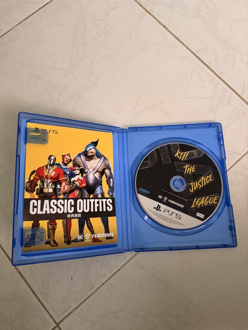 Suicide Squad Kill The Justice League PS5 (Category: PlayStation) located in Lucena. Submitted by lcndeclutter (Listing ID 1467243223, Image 3). Description: - Platform: PlayStation 5 (PS5) - Condition: Physical disc in clean, working condition with original case - Inclusions: Original game case and classic outfits insert - Language: English audio with supported subtitles - Rating: Rated 18+ for mature content - Mode: Action-adventure shooter rea