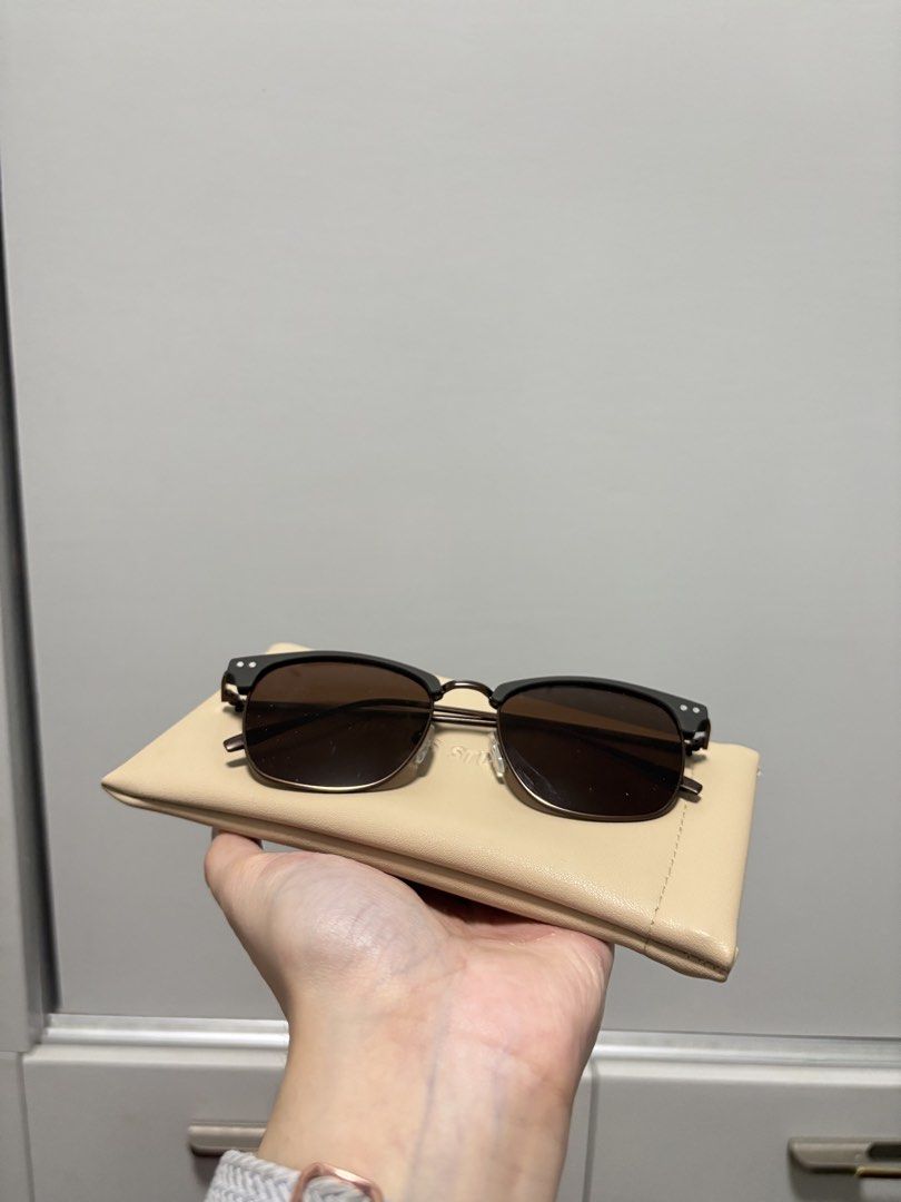 Sunnies Studios Brown Sunglasses with Case (Category: Sunglasses & Eyewear) located in Imus. Submitted by _monicakes (Listing ID 1467169568, Image 1). Description: - Brand: Sunnies Studios - Color: Dark brown frame with tinted brown lenses - Style: Classic browline frame with slim metallic temples - Condition: Clean overall with minimal signs of handling - Inclusions: Original beige faux-leather pouch with debossed logo - Perfect everyday pair.