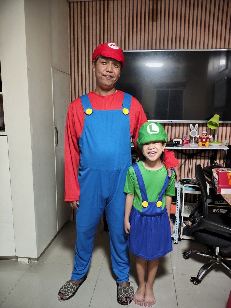 Super Mario and Luigi Costumes Set (Category: Babies & Kids Fashion) located in Cavite. Submitted by nobledeer_10a275_598 (Listing ID 1467230718, Image 1). Description: - Matching Super Mario and Luigi costume set - Perfect for parties, cosplay, or family events - Men's Mario outfit: red shirt, blue overalls with yellow buttons, and 'M' hat - Kid's Luigi outfit: green shirt, blue overall dress with yellow buttons, and 'L' hat - Made with bright c