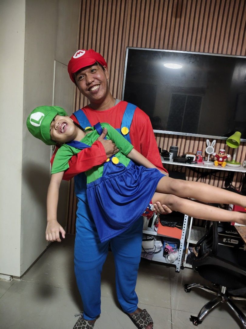 Super Mario and Luigi Costumes Set (Category: Babies & Kids Fashion) located in Cavite. Submitted by nobledeer_10a275_598 (Listing ID 1467230718, Image 2). Description: - Matching Super Mario and Luigi costume set - Perfect for parties, cosplay, or family events - Men's Mario outfit: red shirt, blue overalls with yellow buttons, and 'M' hat - Kid's Luigi outfit: green shirt, blue overall dress with yellow buttons, and 'L' hat - Made with bright c
