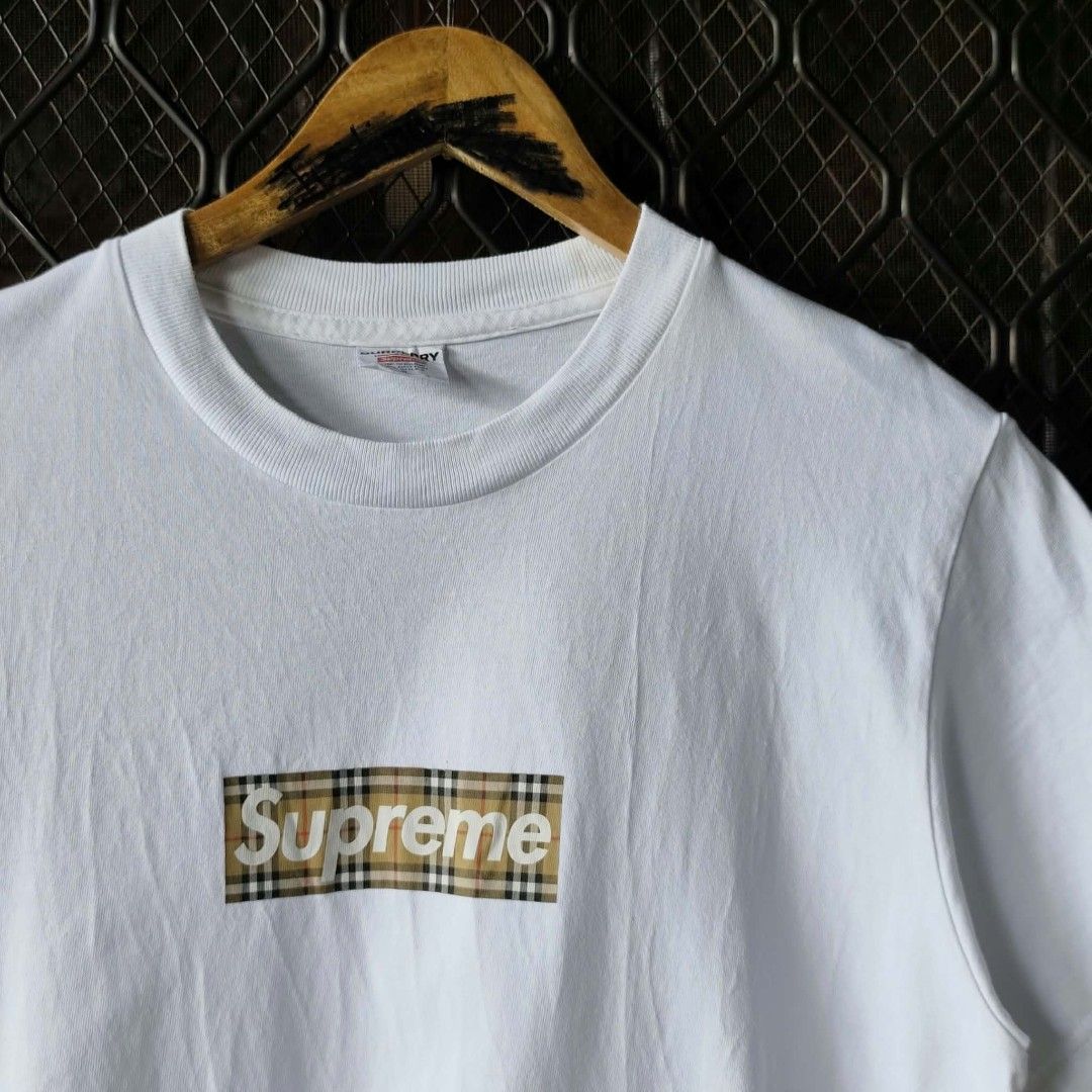 Supreme x Burberry Box Logo White Tee Size S (Category: Tshirts & Polo Shirts ) located in Manila. Submitted by usedbyyatss09 (Listing ID 1467186808, Image 2). Description: - Brand: Supreme x Burberry - Color: Crisp White - Size: Small (Regular Fit) 20x27 - Material: 100% Pre-shrunk cotton (Made in U.S.A.) - Design: Iconic nova check box logo graphic on chest - Details: Double-stitched hems, clean neck tag, and proper care label attached.