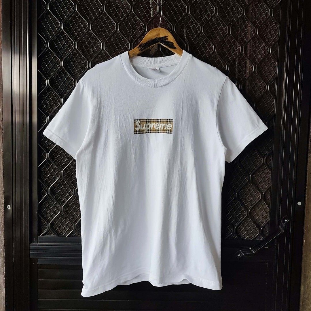 Supreme x Burberry Box Logo White Tee Size S (Category: Tshirts & Polo Shirts ) located in Manila. Submitted by usedbyyatss09 (Listing ID 1467186808, Image 1). Description: - Brand: Supreme x Burberry - Color: Crisp White - Size: Small (Regular Fit) 20x27 - Material: 100% Pre-shrunk cotton (Made in U.S.A.) - Design: Iconic nova check box logo graphic on chest - Details: Double-stitched hems, clean neck tag, and proper care label attached.