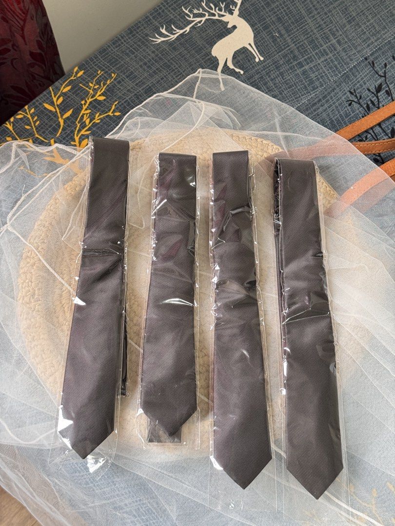 TAKE ALL: 4 black formal ties in plastic wraps (Category: Ties) located in San Pedro. Submitted by halfunread (Listing ID 1467296876, Image 2). Description: - Individually wrapped in clear plastic bags - Textured fabric with a classic diagonal twill weave - Standard width style - Ideal for office wear, weddings, and formal events Pickup at Biñan laguna.