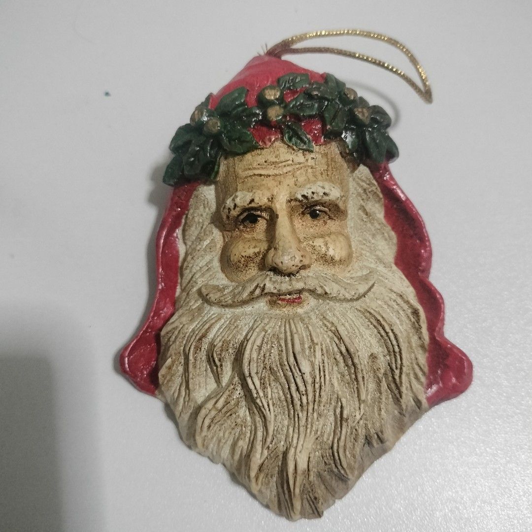 Take all Santa face Christmas tree ornament (Category: Vintage Collectibles) located in Angeles City. Submitted by hellokittysanta (Listing ID 1467359974, Image 1). Description: - Santa Claus face Christmas tree ornament - Made of durable molded resin - Detailed beard, mustache, and traditional red and green holly wreath crown - Includes a gold cord loop for easy hanging - Perfect festive holiday decor piece for your home.