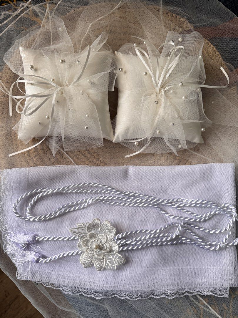 Take All Wedding set: Pillow Veil Cord (Category: Accessory Holder, Box & Organizers) located in San Pedro. Submitted by halfunread (Listing ID 1467296410, Image 1). Description: - Matching white wedding set - 2 satin ring pillows with tulle overlay, ribbons, and pearl beads - 1 high quality white lace veil piece - 1 braided cord with embroidered floral applique and tassels Pick up at Biñan Laguna.