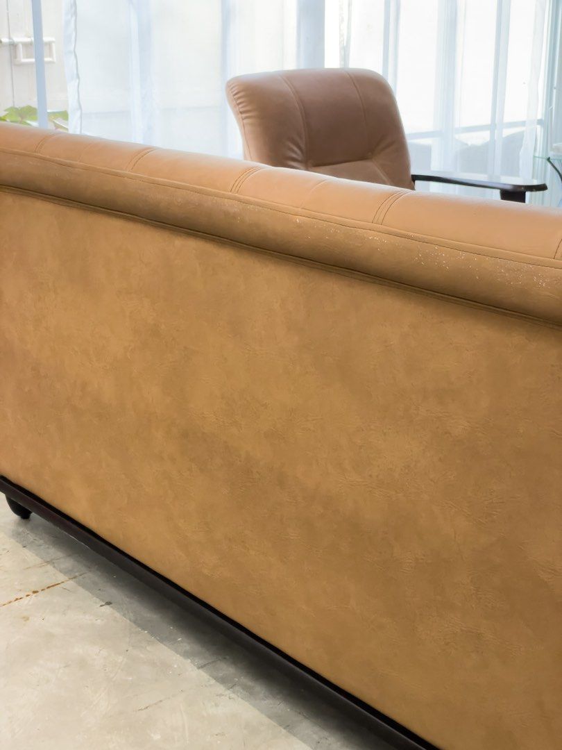 Tan leather sofa with dark wood frame (Category: Sofas) located in Rizal. Submitted by lori6848 (Listing ID 1467233586, Image 3). Description: Pick up location: Antipolo.