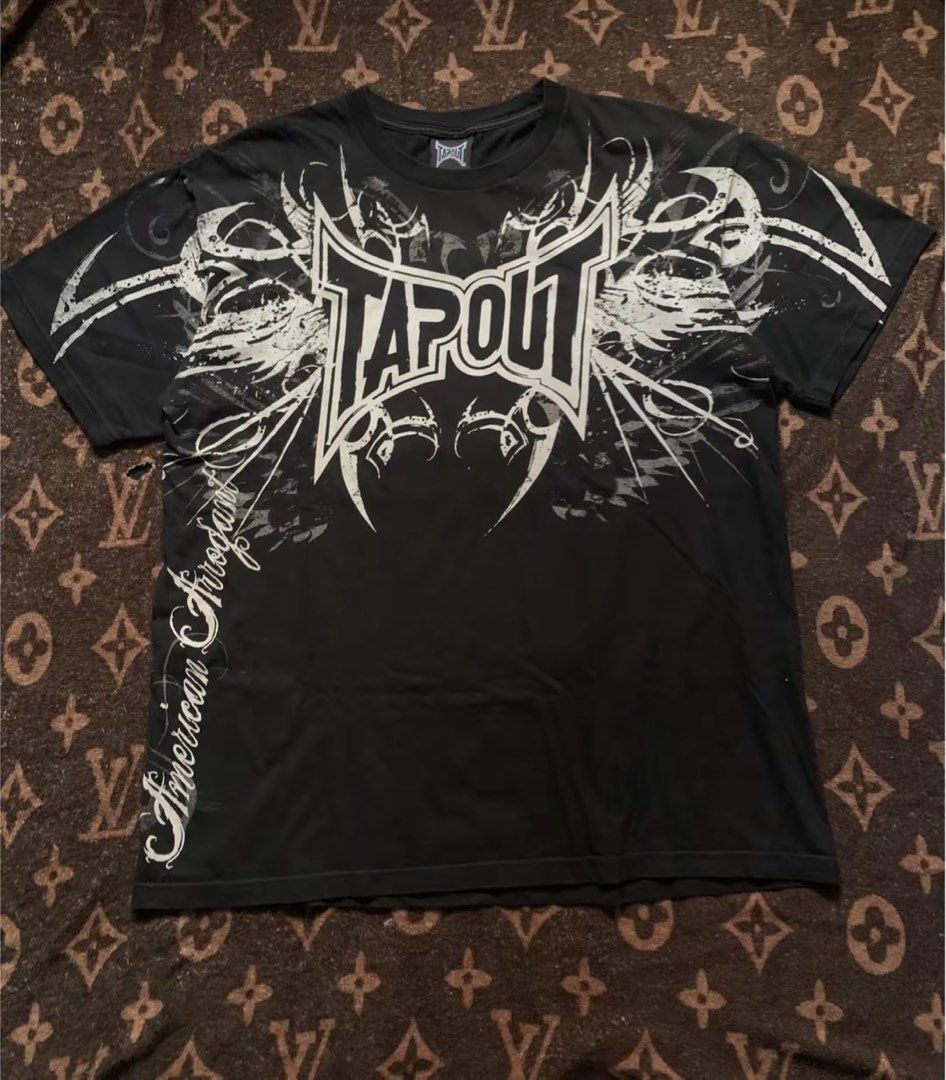 TAPOUT TRIBAL (Category: Formal Shirts) located in Manila. Submitted by bobzshoppp (Listing ID 1467211670, Image 2). Description: TAPOUT TRIBAL Large on tag W-22 L-27.5-28 condition 10/10 No issue: FORSALE DM Note:⚠️⚠️ ⚠️ - Expect some minor flaws as the item was thrifted -Color may vary due to lightning - Shipping fee must be shouldered by the buyer .