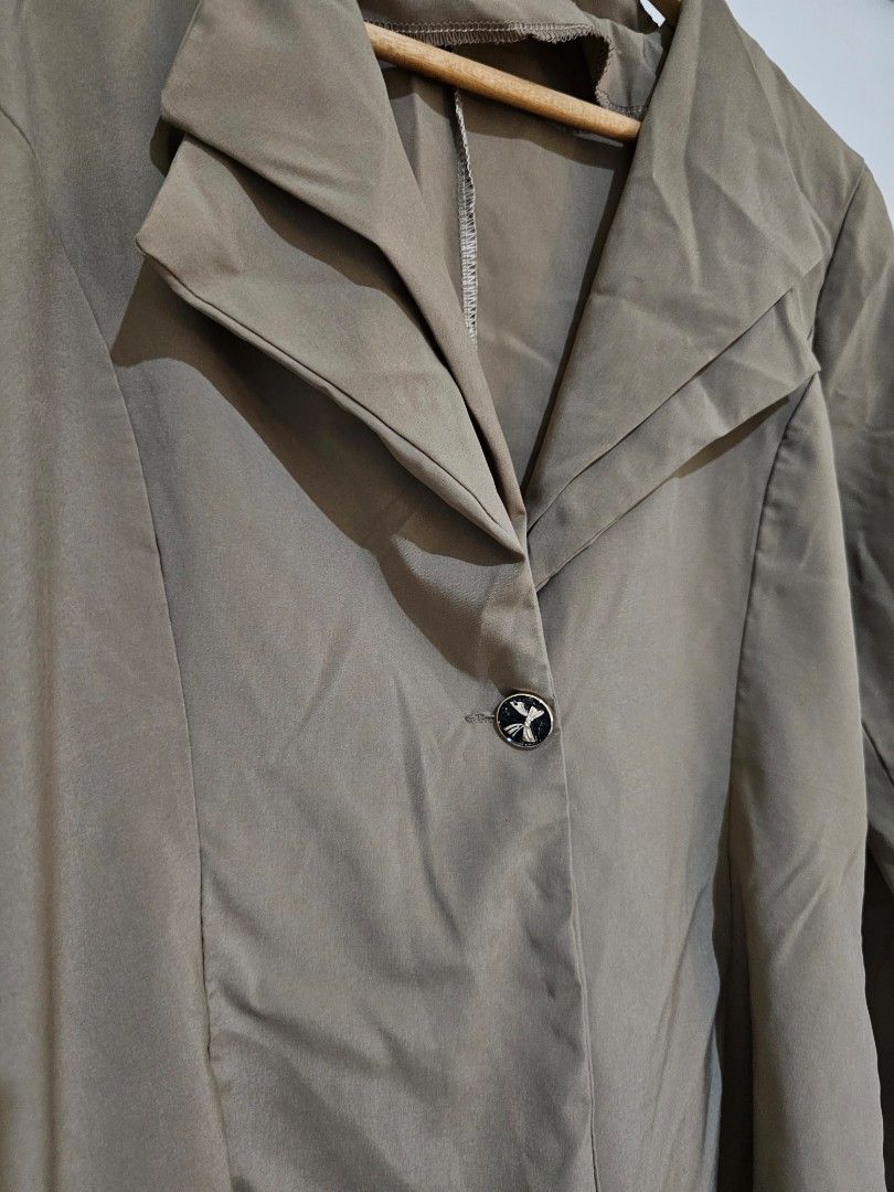 Taupe Long Sleeve Blazer Jacket (Category: Coats, Jackets and Outerwear) located in Quezon City. Submitted by moanascloset (Listing ID 1467351802, Image 3). Description: - Brand: I.Candy - Color: Taupe - Style: Long sleeves, structured collar, standard fit - Detail: One decorative center button with a small bow design - Fabric: Lightweight, ideal for layering over tops and dresses - Condition: Excellent.