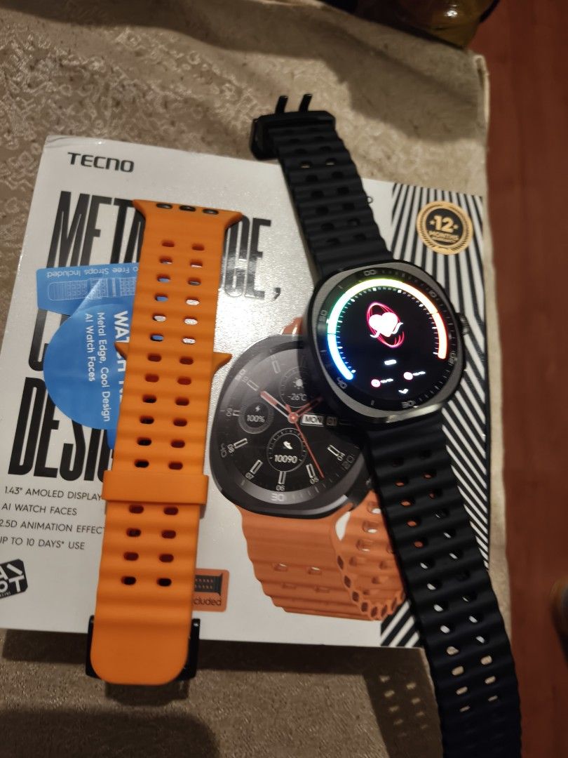 Tecno watch Neo 2 (Category: Wearables & Smart Watches) located in Manila. Submitted by bravefox_31b6f5 (Listing ID 1467286738, Image 3). Description: - Brand: Tecno Watch Neo 2 - Display: 1.43" AMOLED with AI watch faces - Design: Metal edge with sleek modern look - Straps: Includes extra interchangeable straps in black and orange - Condition: slightly used in box still with warranty Meet Up: Angono Rizal Shipping available at buyers expense.