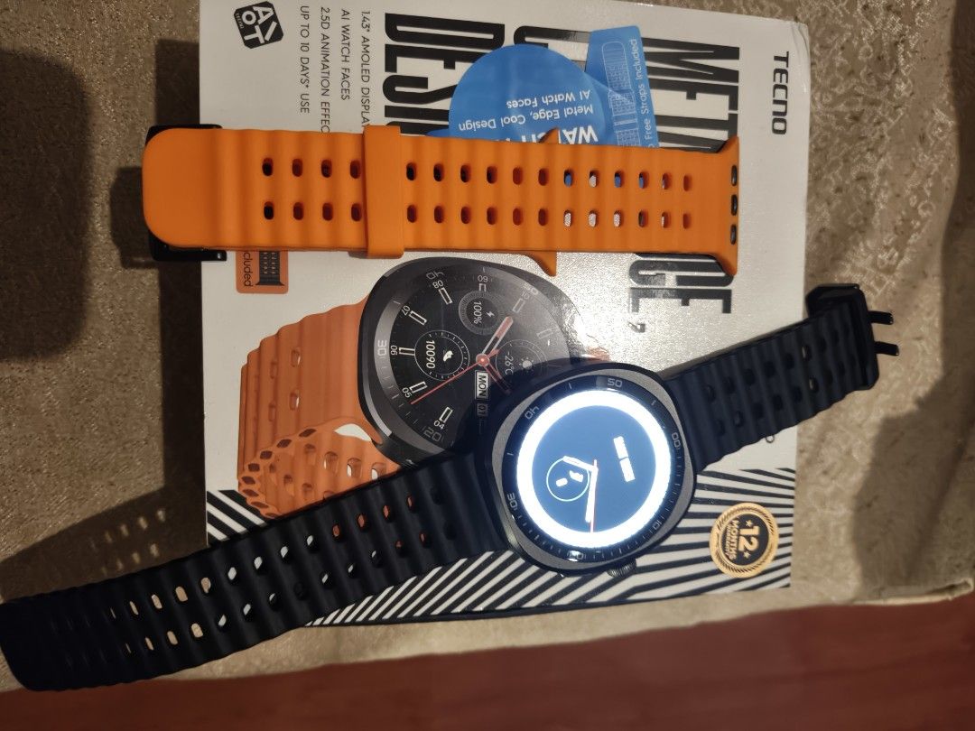 Tecno watch Neo 2 (Category: Wearables & Smart Watches) located in Manila. Submitted by bravefox_31b6f5 (Listing ID 1467286738, Image 2). Description: - Brand: Tecno Watch Neo 2 - Display: 1.43" AMOLED with AI watch faces - Design: Metal edge with sleek modern look - Straps: Includes extra interchangeable straps in black and orange - Condition: slightly used in box still with warranty Meet Up: Angono Rizal Shipping available at buyers expense.