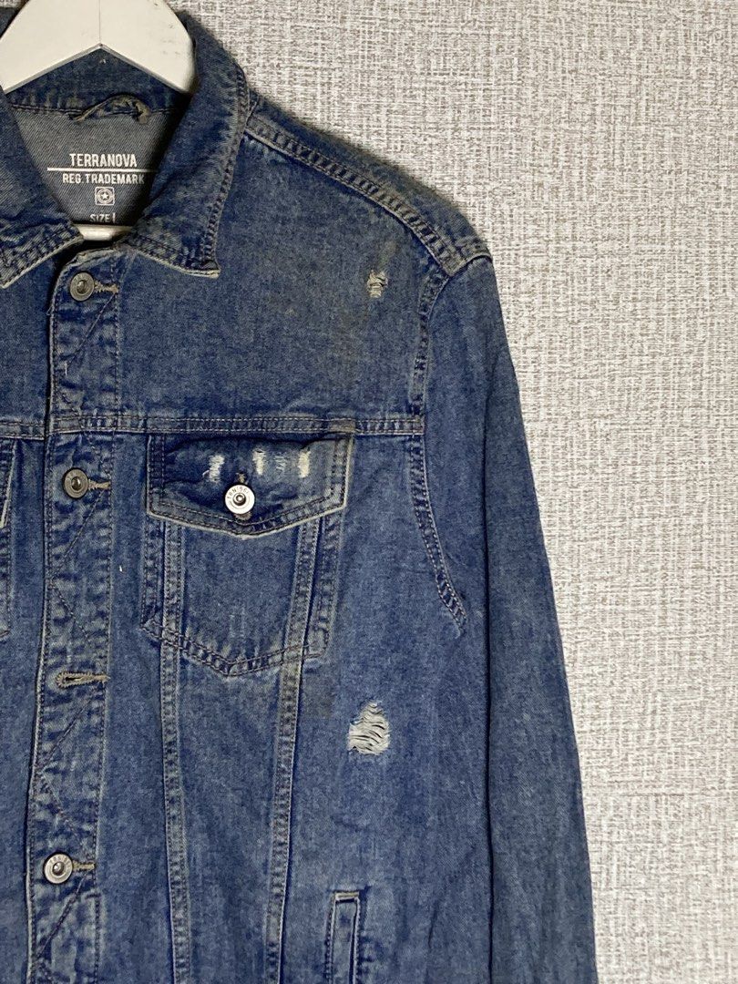 Terranova Blue Denim Jacket Distressed Size L (Category: Coats, Jackets and Outerwear) located in Baguio. Submitted by drip_n_drop (Listing ID 1467324714, Image 2). Description: - Brand: Terranova (Teddy S.P.A.) - Size: L - Wash: Medium blue with stylish distressed details on the chest and front - Pockets: Dual chest flap pockets and convenient side slip pockets - Closure: Classic button-up with a standard collar neckline - Condition: Great casua