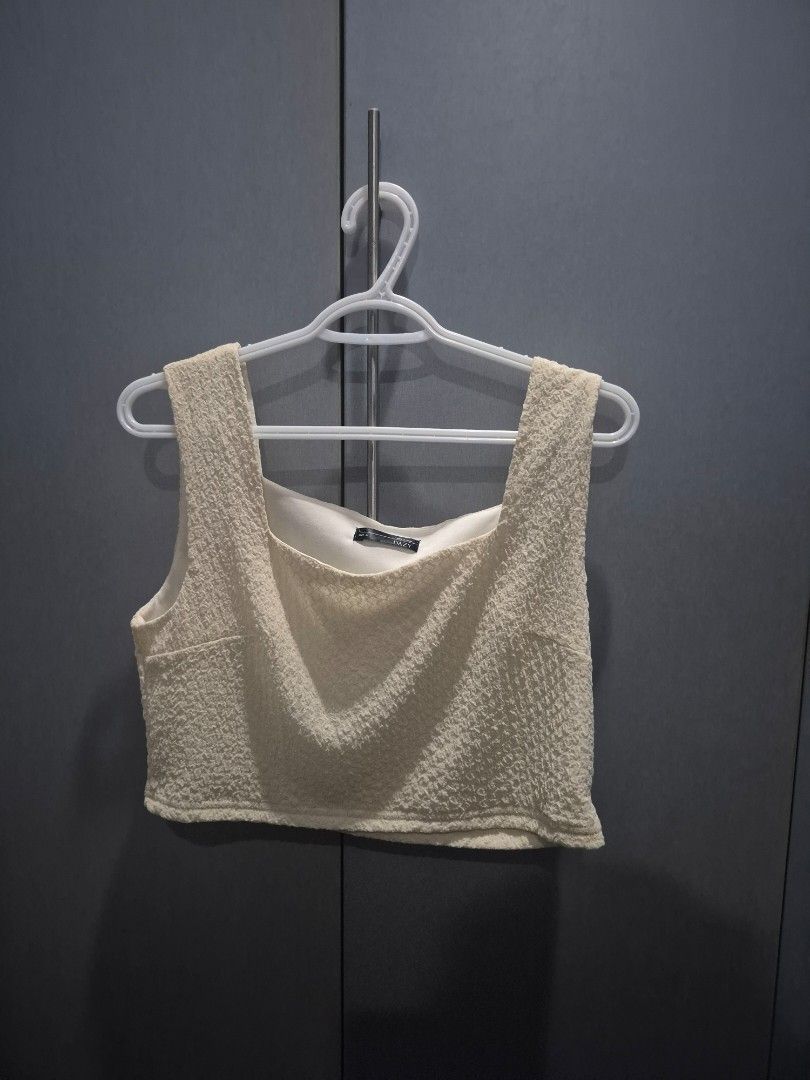 Textured Cream Crop Top (Category: Sleeveless) located in Pasig City. Submitted by jeneee_0824 (Listing ID 1467274721, Image 1). Description: Item: Cream Textured Sleeveless Top in Large *Selling it cause its too small for me.