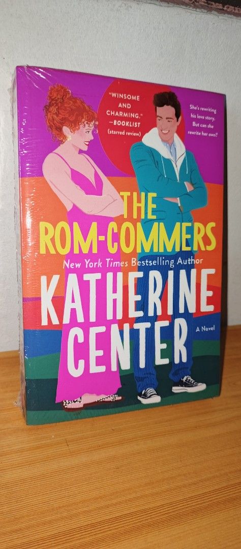 The Rom-Commers by Katherine Center (Category: Storybooks) located in Manila. Submitted by freestarbook (Listing ID 1467207802, Image 1). Description: - Title: The Rom-Commers by New York Times bestselling author Katherine Center - Format: St. Martin's Griffin paperback edition - Condition: Brand new, plastic-wrapped, and unopened - Price Tag: National Book Store tag still attached showing ₱695.00 - Synopsis: Follow Emma Wheeler as she lands a dr