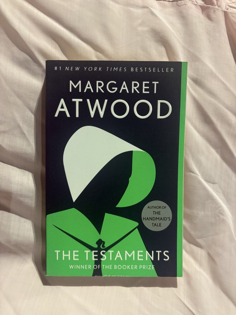 The Testaments by Margaret Atwood (Category: Storybooks) located in San Juan City. Submitted by mermaidmote7 (Listing ID 1467238241, Image 1). Description: - Title: The Testaments by Margaret Atwood (Sequel to The Handmaid's Tale) - Format: Softcover with striking cover illustration by Noma Bar - Special Features: Includes exclusive additional material inside - Accolades: Booker Prize Winner and #1 New York Times Bestseller - Condition: Brand new