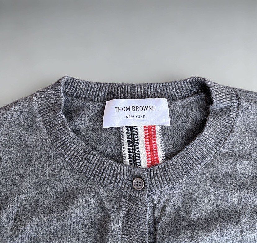 Thom browne knitted cardigan (Category: Luxury Apparel) located in Manila. Submitted by 2ndmemoir (Listing ID 1467195806, Image 2). Description: Thom browne issue cut washtag one missing botton Excellent condition 9.8 colorate Good as new No flaws Need wash .