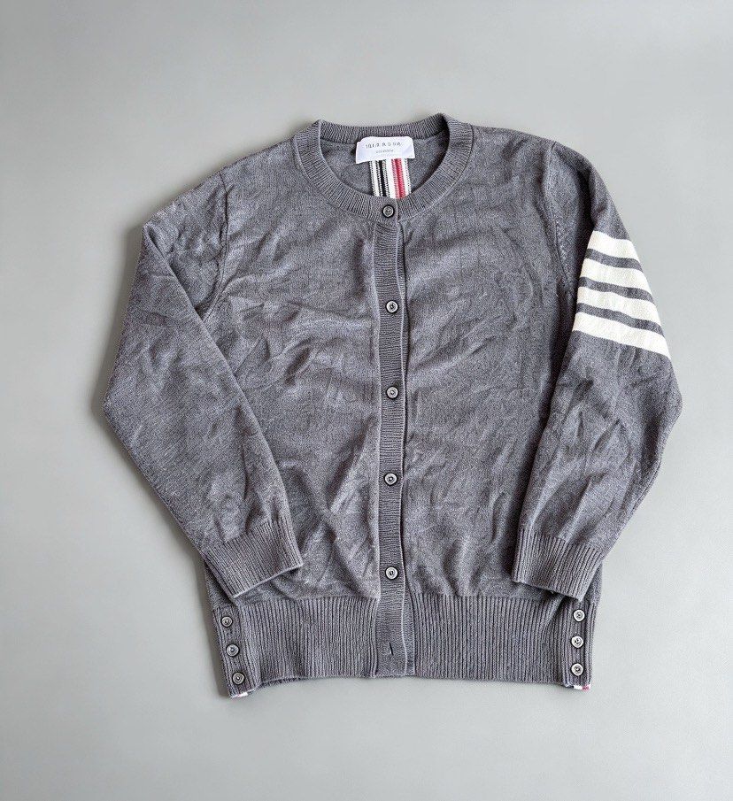 Thom browne knitted cardigan (Category: Luxury Apparel) located in Manila. Submitted by 2ndmemoir (Listing ID 1467195806, Image 1). Description: Thom browne issue cut washtag one missing botton Excellent condition 9.8 colorate Good as new No flaws Need wash .
