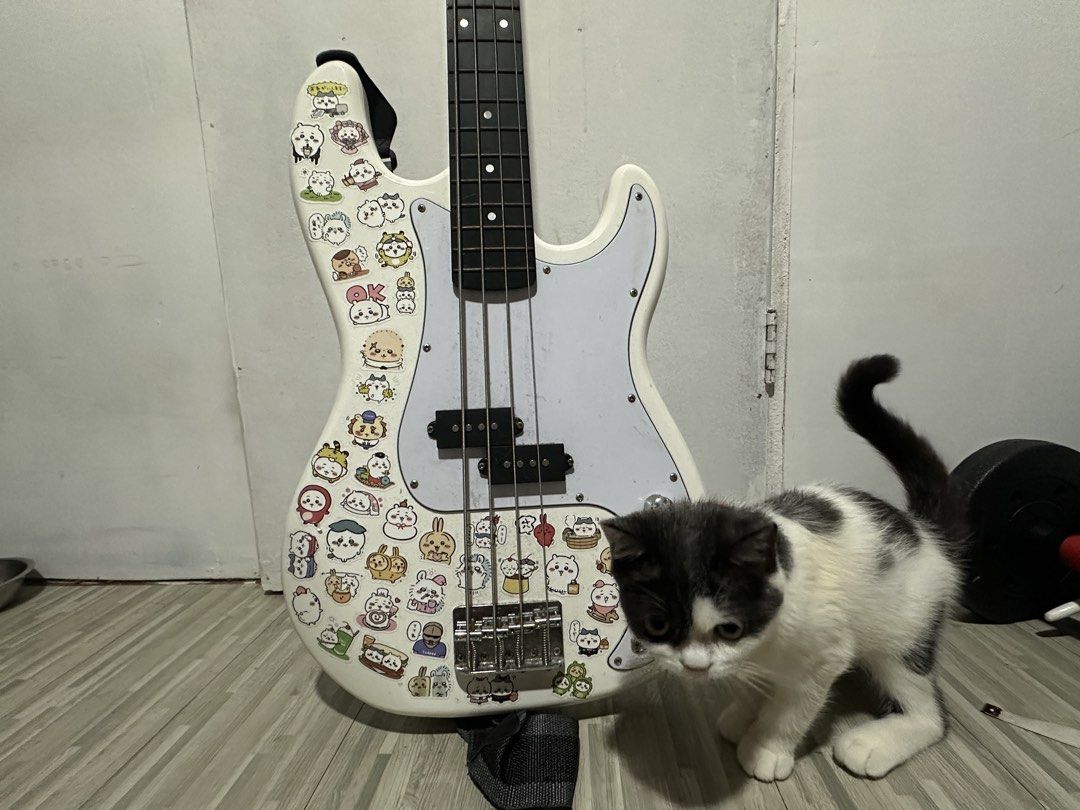 Thomson 4 String P-Bass (Category: Musical Instruments) located in Malabon City. Submitted by pluto23.5 (Listing ID 1467305548, Image 1). Description: Thomson 4 String P Bass Guitar Needs cleaning and tuning, haven’t used in a long time since my amplifier broke. Stickers can be removed, not permanent! Included: Guitar bag Ampli cord Di kasama yung pusa.