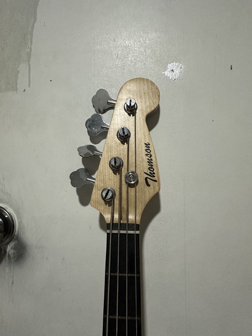 Thomson 4 String P-Bass (Category: Musical Instruments) located in Malabon City. Submitted by pluto23.5 (Listing ID 1467305548, Image 3). Description: Thomson 4 String P Bass Guitar Needs cleaning and tuning, haven’t used in a long time since my amplifier broke. Stickers can be removed, not permanent! Included: Guitar bag Ampli cord Di kasama yung pusa.