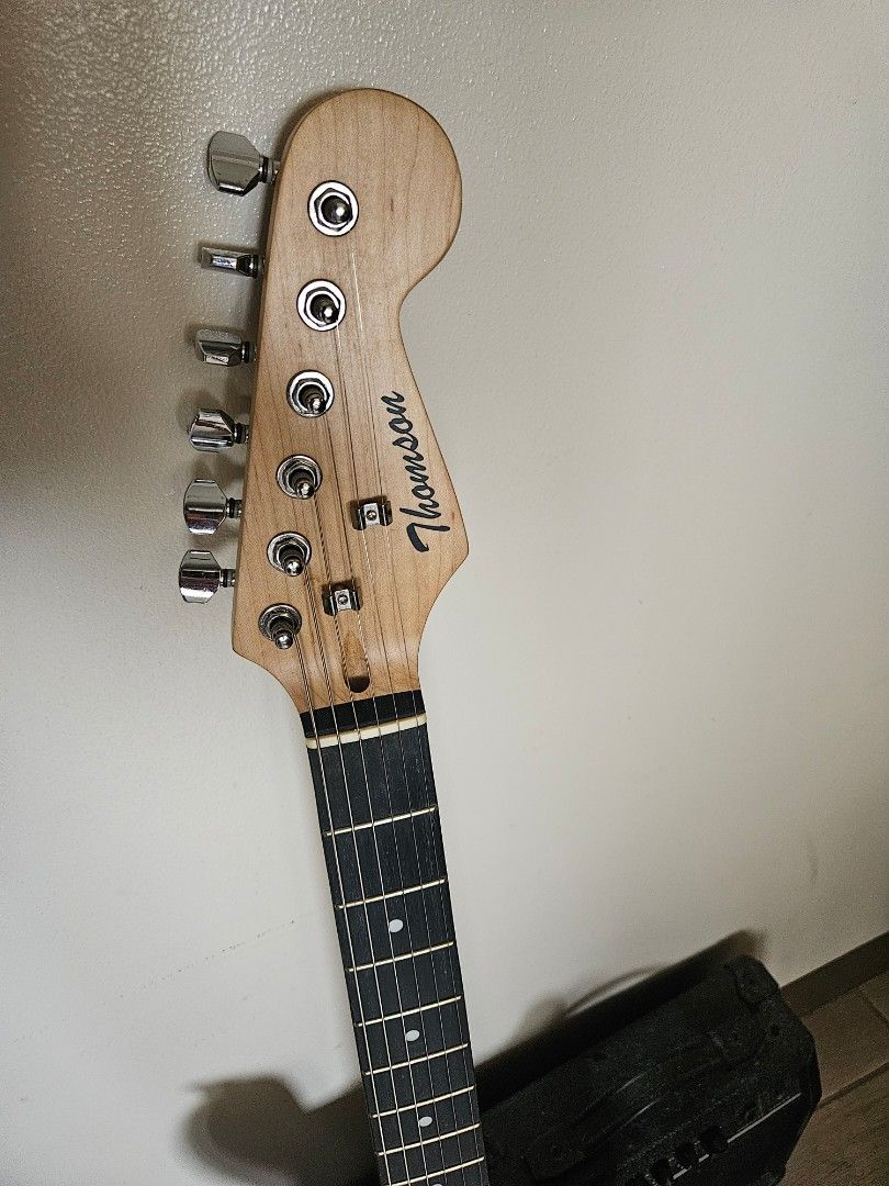 Thomson Stratocaster Electric Guitar and Amplifier (Category: Musical Instruments) located in Mandaluyong City. Submitted by declutterice (Listing ID 1467339738, Image 3). Description: - Brand/Model: Thomson Electric Guitar - Finish: Sunburst with white pickguard and custom Naruto character stickers - Headstock: Thomson logo 6k negotiable. Lc. .Makati Complete accesories.