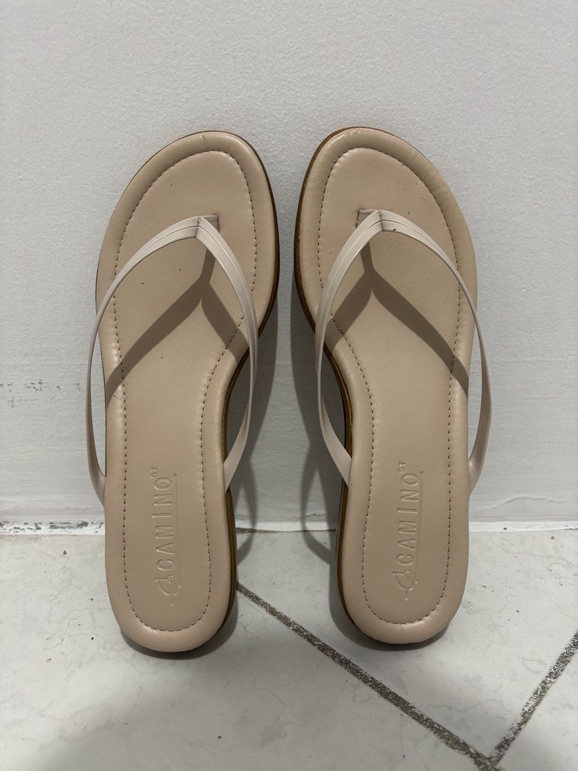 Thong Wedge Sandals (Category: Flats & Sandals) located in Manila. Submitted by safefire.ae92b7 (Listing ID 1467310513, Image 2). Description: - Color: Neutral beige with a contrasting light brown sole - Style: Simple slip-on thong sandals with thin straps and a low heel - Size: 7 - Good condition used twice .