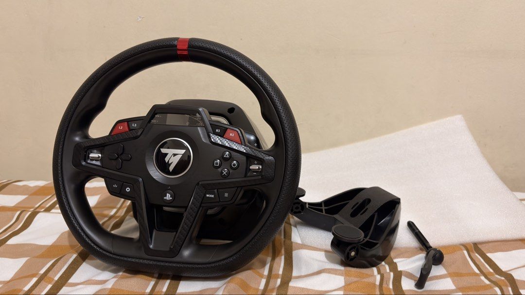 Thrustmaster T248R for racing simulator, and driving simulator. Includes steering wheel and pedals (Category: Controllers) located in Manila. Submitted by marjcoron24673 (Listing ID 1467318680, Image 2). Description: Used but in brand-new condition. Lady owned Original box included. Selling kasi hindi na nakakapaglaro. I’d rather let someone else get more use out of it. Bought this for ~Php 16,000 Selling for Php 14,000 (Negotiable) Inclusions: 1