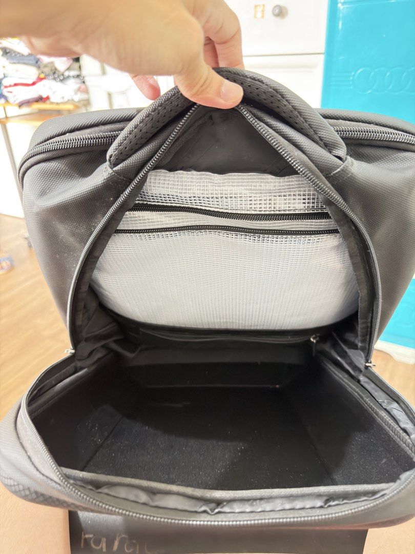 Tigernu Black Hard Shell Laptop Backpack (Category: Backpacks) located in Makati City. Submitted by thisisshy (Listing ID 1467234432, Image 3). Description: - Brand: Tigernu - Color: Black - Design: Durable hard shell front for maximum protection - Comfort: Padded shoulder straps and breathable mesh back panel - Laptop Compartment: Dedicated sleeve with blue shockproof padding and securing strap - Organization: Multiple internal pockets and gear 