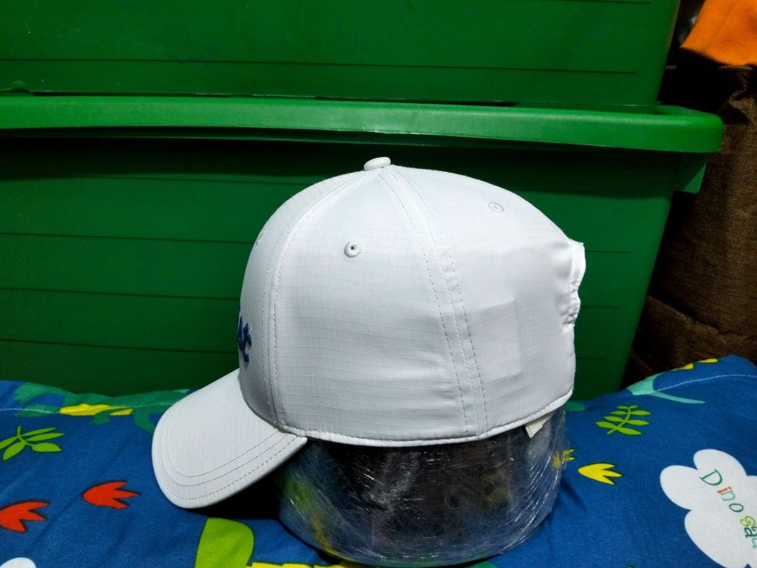 Titleist White Golf Cap Hat With Blue Script Logo (Category: Caps & Hats) located in San Mateo. Submitted by JmThriftCap_Ph (Listing ID 1467317249, Image 3). Description: - Authentic Titleist golf cap in crisp white - Eye-catching bold blue raised script logo on the front - Durable ripstop grid fabric construction - Adjustable strapback closure with small Titleist branding tab - Interior taped seams branded with Titleist text - Structured crown a